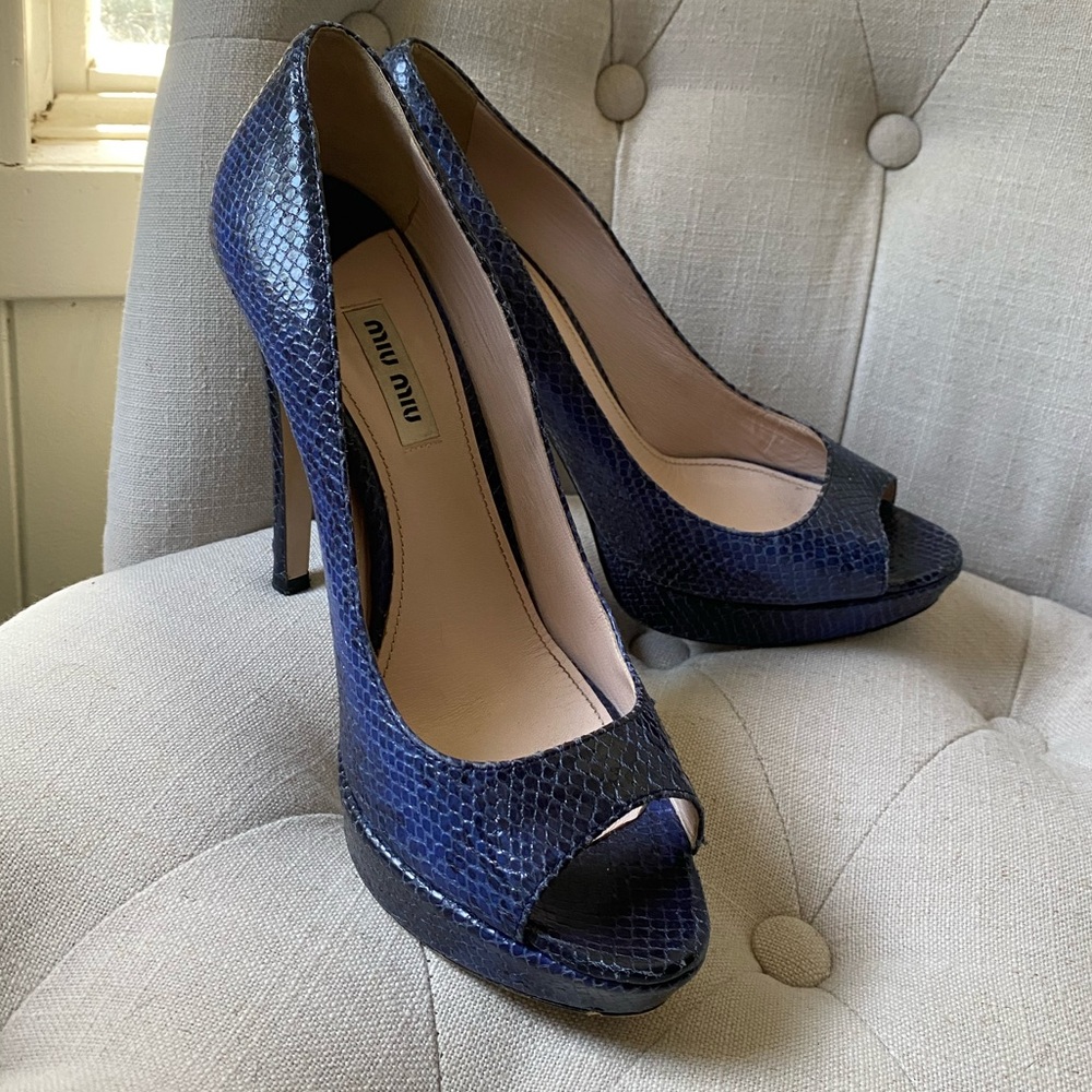 Blue Miu miu pumps.  4 1/2 inches
